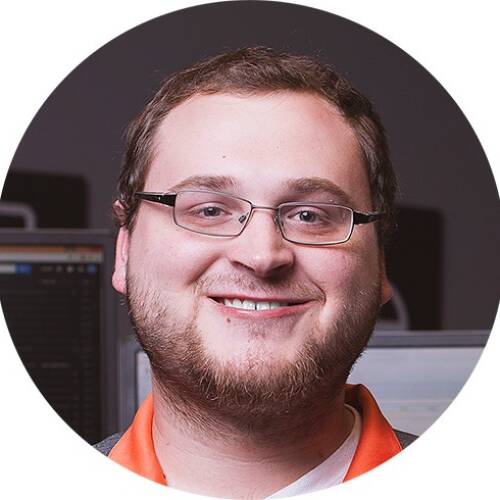Jarrett Weber smiles with teeth.